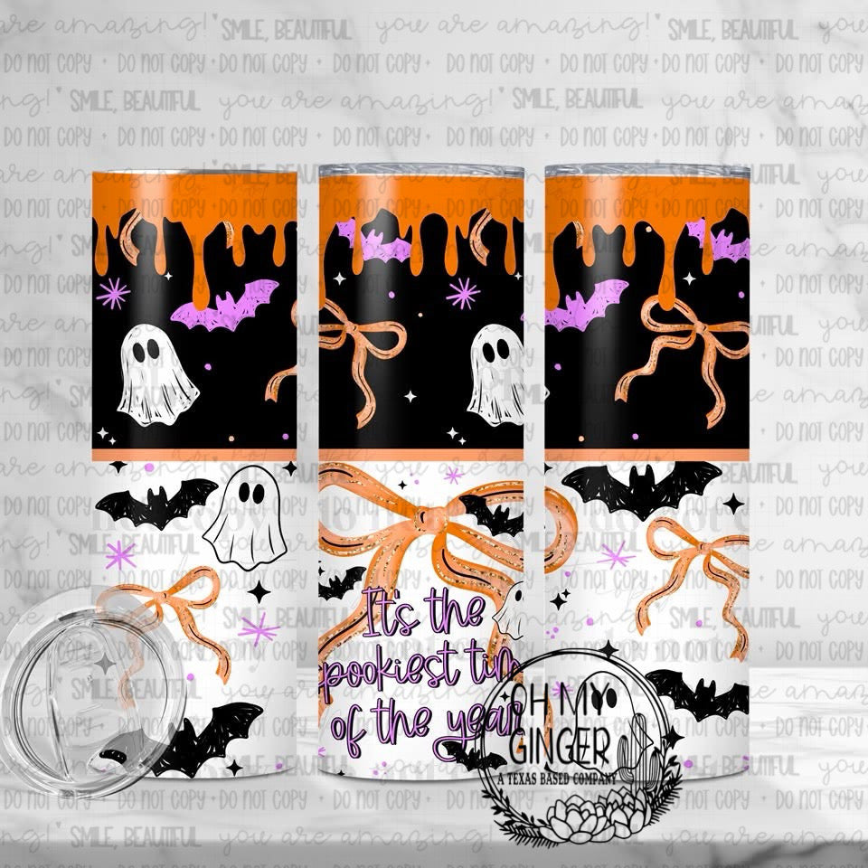 It’s The Spookiest Time Of The Year Skinny Tumbler featuring ghosts, bats, pumpkins and dripping black Halloween panels with pink and orange accents by Oh My Ginger