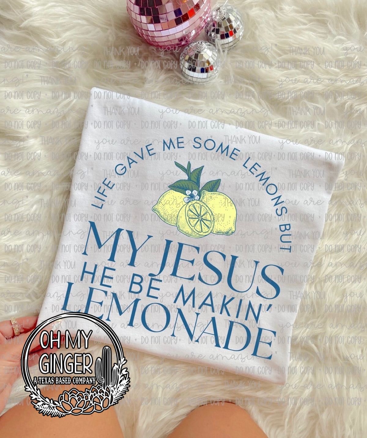 My Jesus He Be Makin’ Lemonade adult apparel design featuring an uplifting Christian design built around the playful My Jesus He Be Makin’ Lemonade phrase by Oh My Ginger
