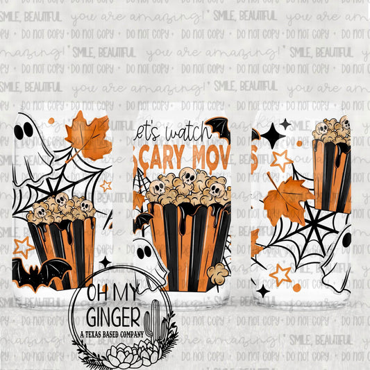 Let’s Watch Scary Movies Glass Can featuring movie popcorn, ghosts, skulls, spiderwebs and fall leaves with Let's Watch Scary Movies lettering by Oh My Ginger