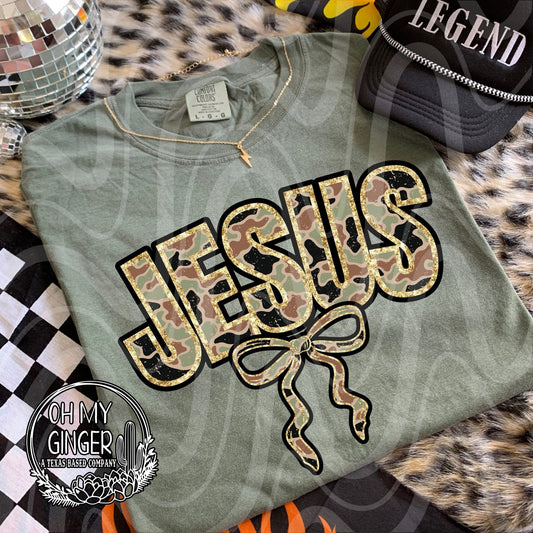 Camo Jesus Bow adult apparel design featuring a faith-based Jesus design blending camouflage details with a feminine bow accent by Oh My Ginger