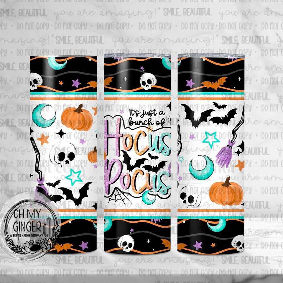 It’s Just A Bunch Of Hocus Pocus Skinny Tumbler featuring Hocus Pocus lettering surrounded by skulls, bats, moons and pumpkins by Oh My Ginger