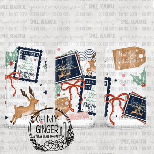 Deliver By December 25 Glass Can featuring North Pole delivery stamps, reindeer, parcels, holly and red ribbon bows by Oh My Ginger