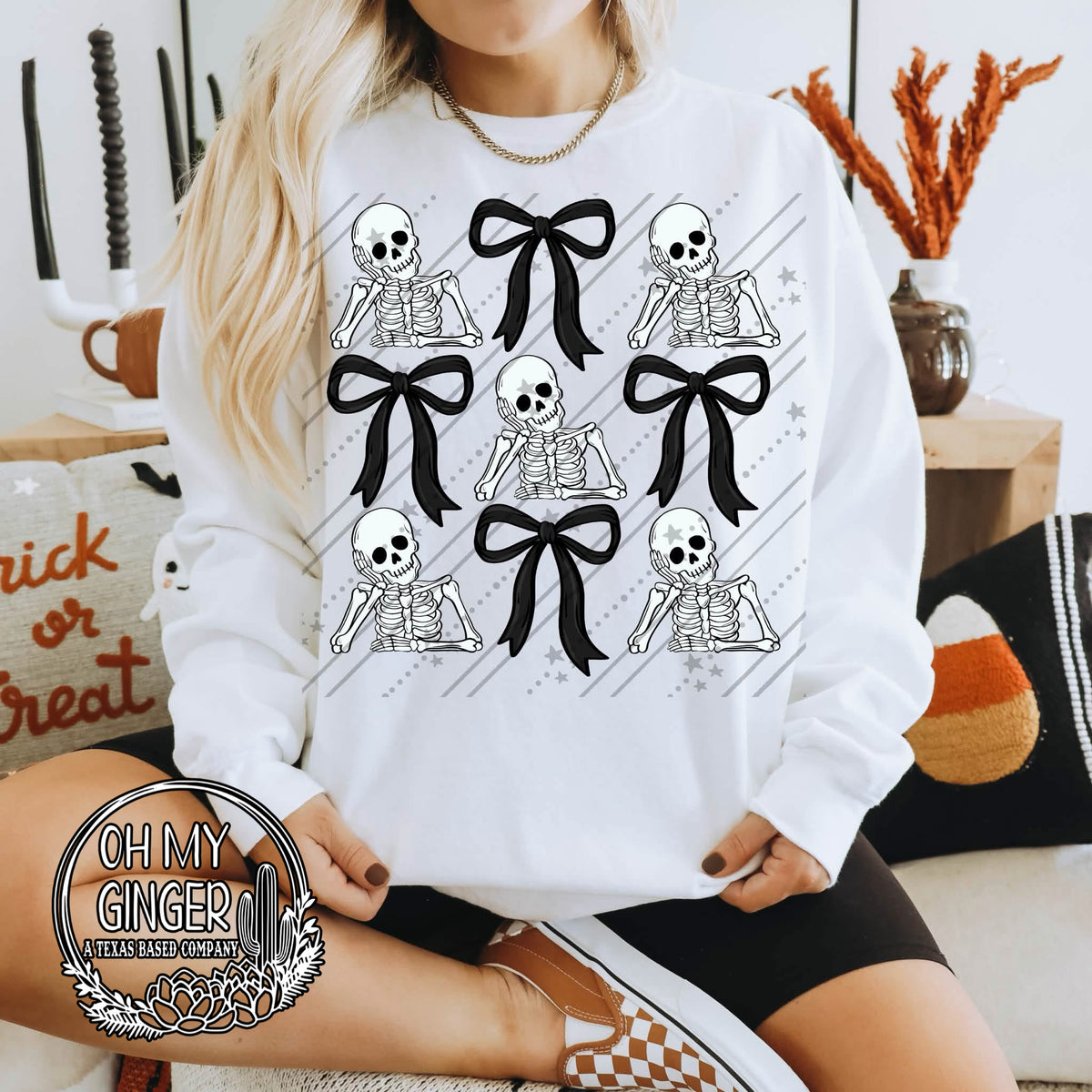 Skeleton & Bow Collage adult apparel design featuring a trendy Halloween collage combining skeleton details with feminine bow accents by Oh My Ginger