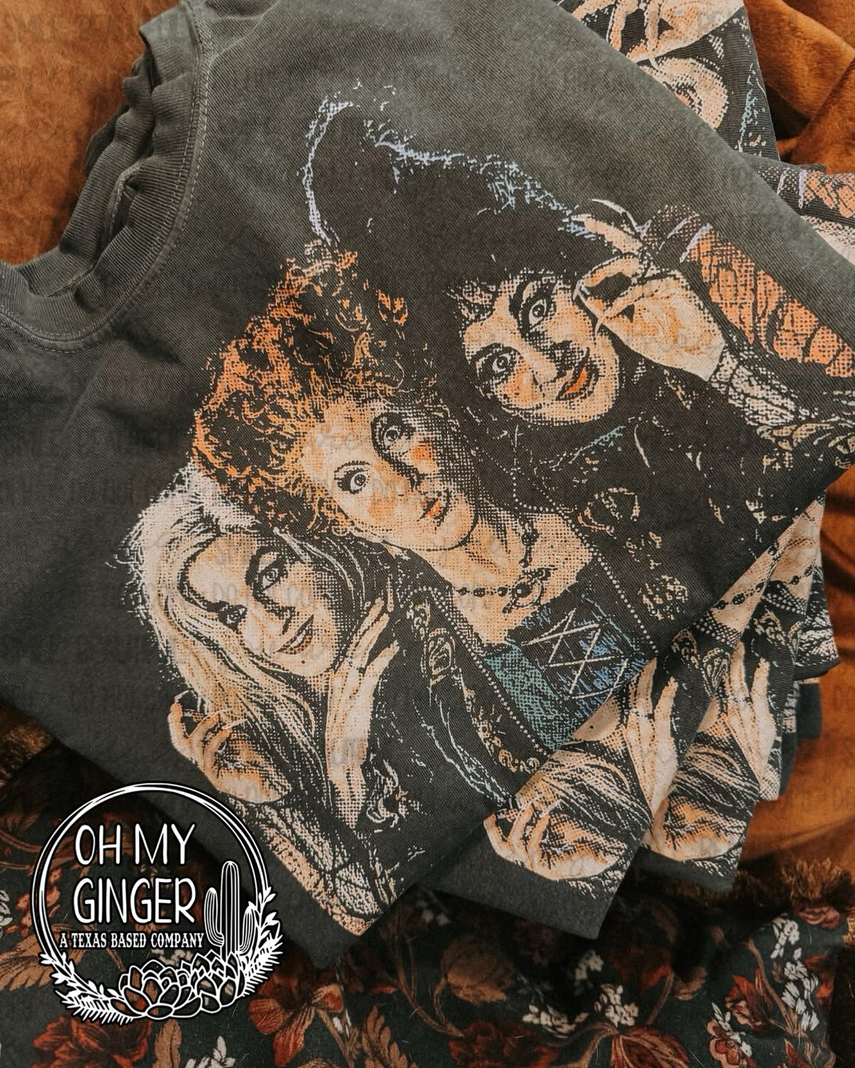 Sanderson Sisters design featuring a vintage distressed portrait of the three Sanderson sisters in warm orange, cream, teal and black tones by Oh My Ginger