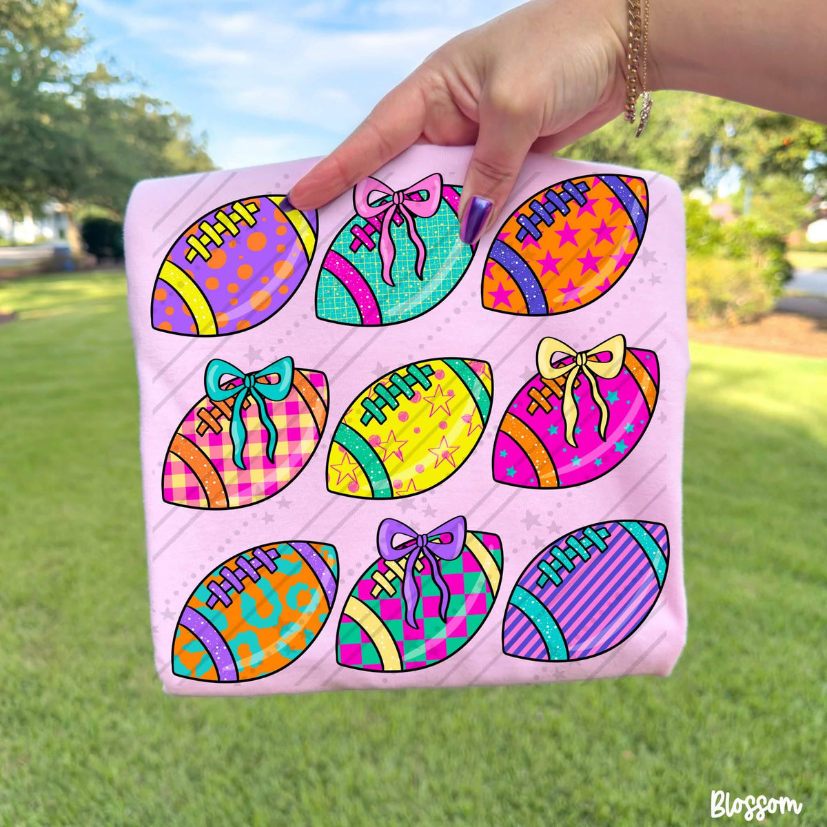 Football Bows design featuring nine colorful footballs decorated with checkerboard, plaid, stripes, stars, leopard spots and coordinating bows by Oh My Ginger