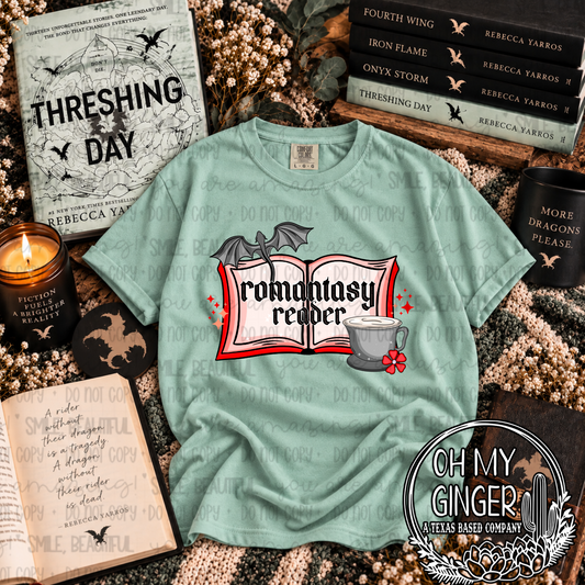 Romantasy Reader graphic tee featuring an open book, winged dragon, mug and red floral accents