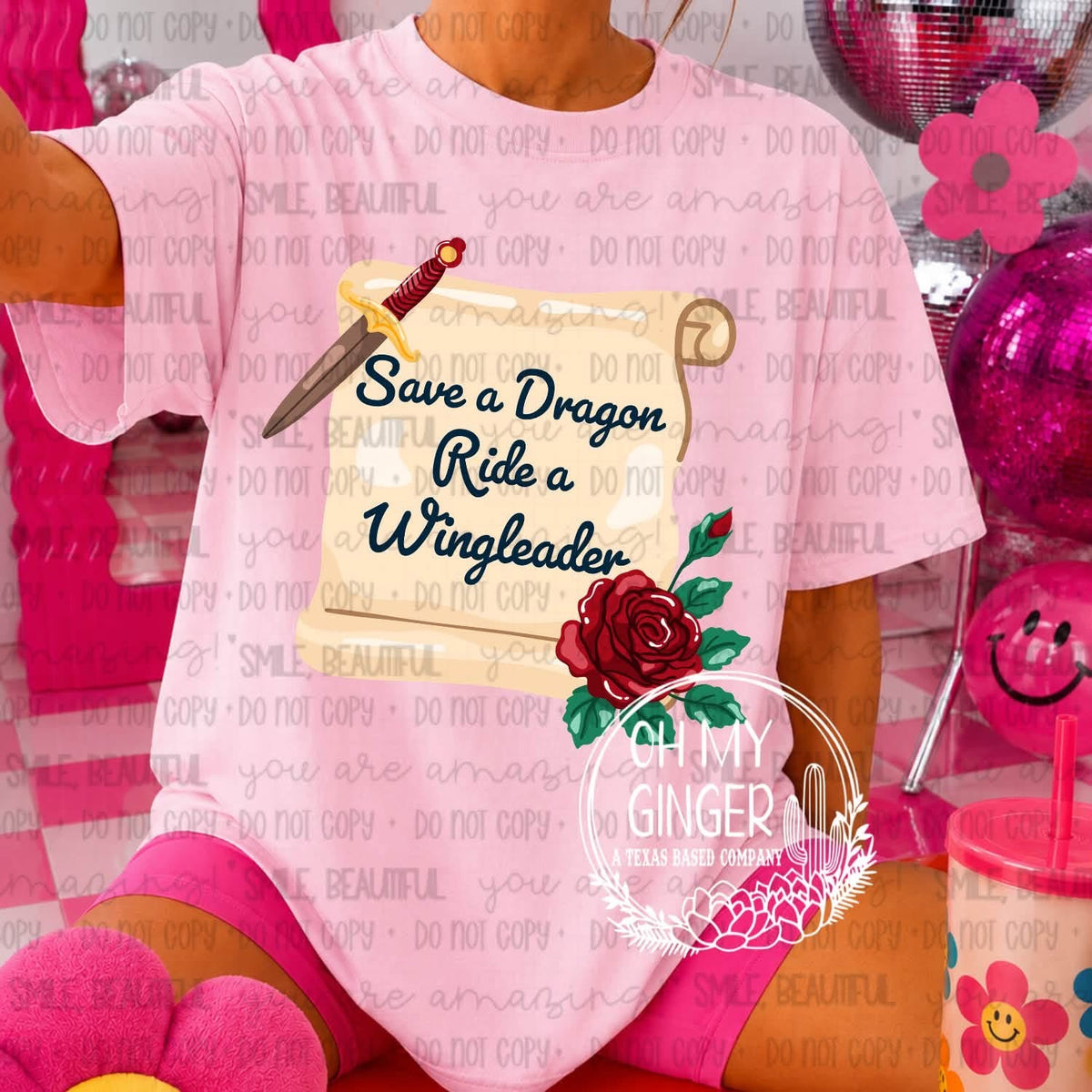 Save A Dragon, Ride A Wingleader apparel mockup. “Save a Dragon, Ride a Wingleader” lettering appears on a parchment-style scroll with a dagger and red rose.